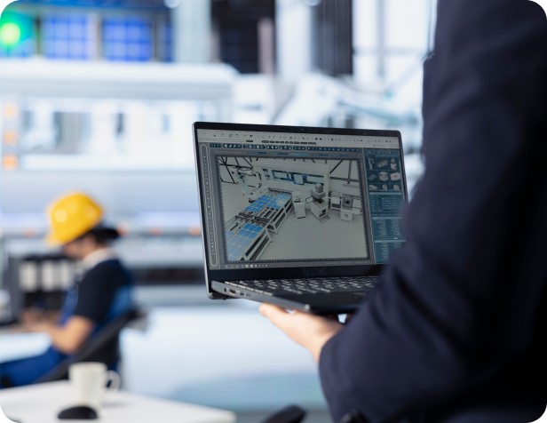 Reviewing a digital building scan on a laptop at a project site